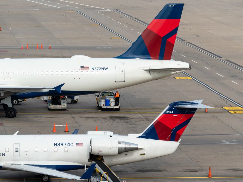 tails of Delta aircraft displaying tail numbers