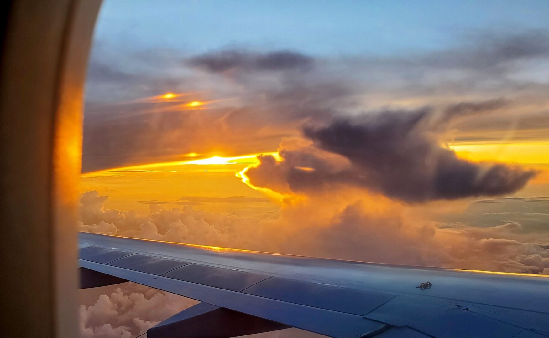 Sunset outside of plane window